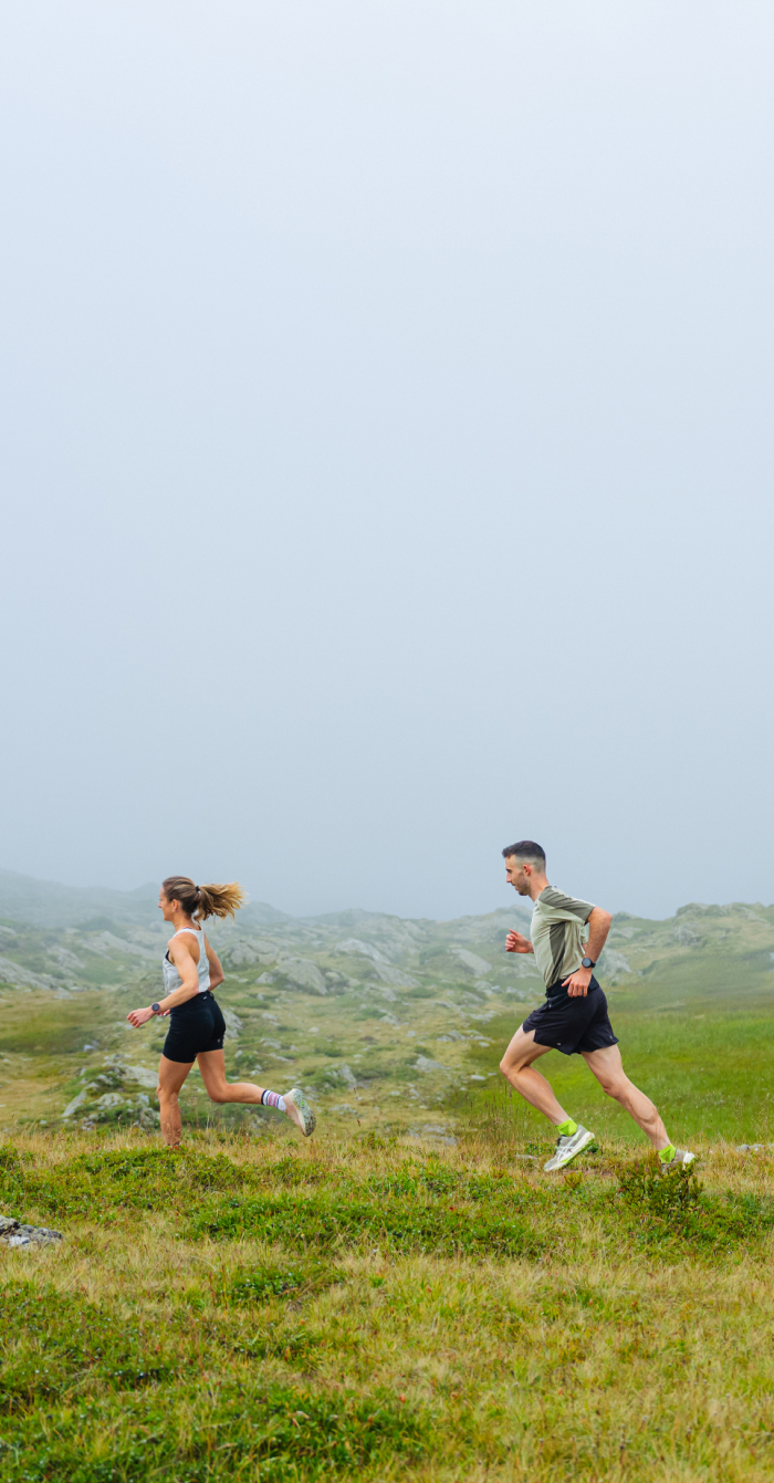 Two trail runners in nature